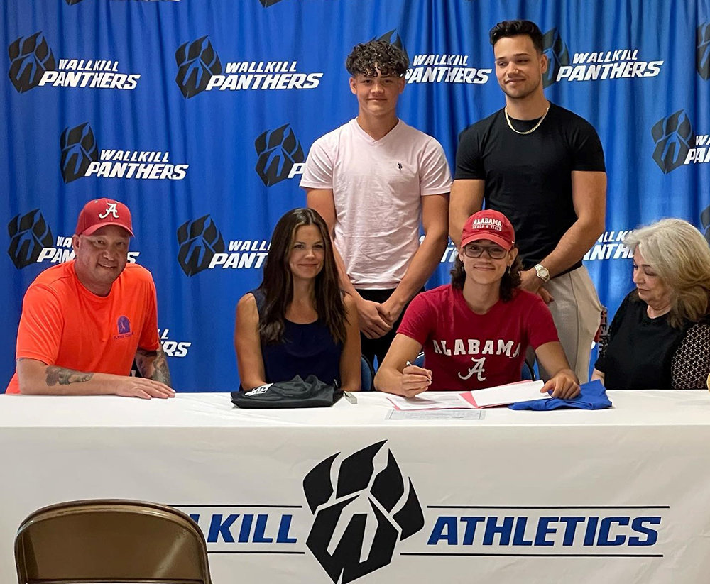 Wallkill senior Louis Martinez is shown with his family after signing his National Letter of Intent to pole vault at the University of Alabama on June 22 at Wallkill High School.